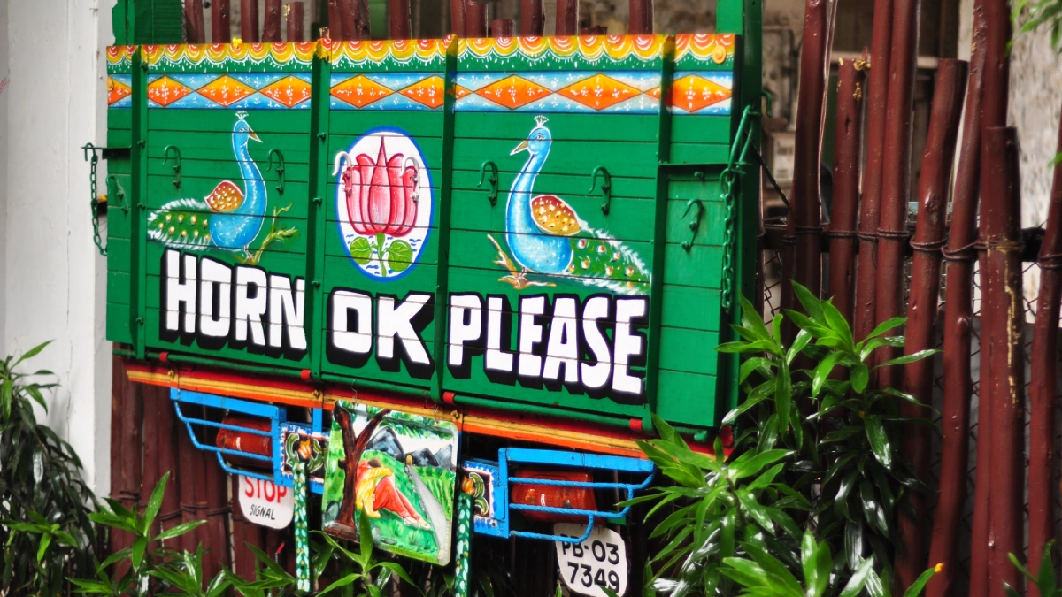 Horn OK Please painted on the back of an Indian truck